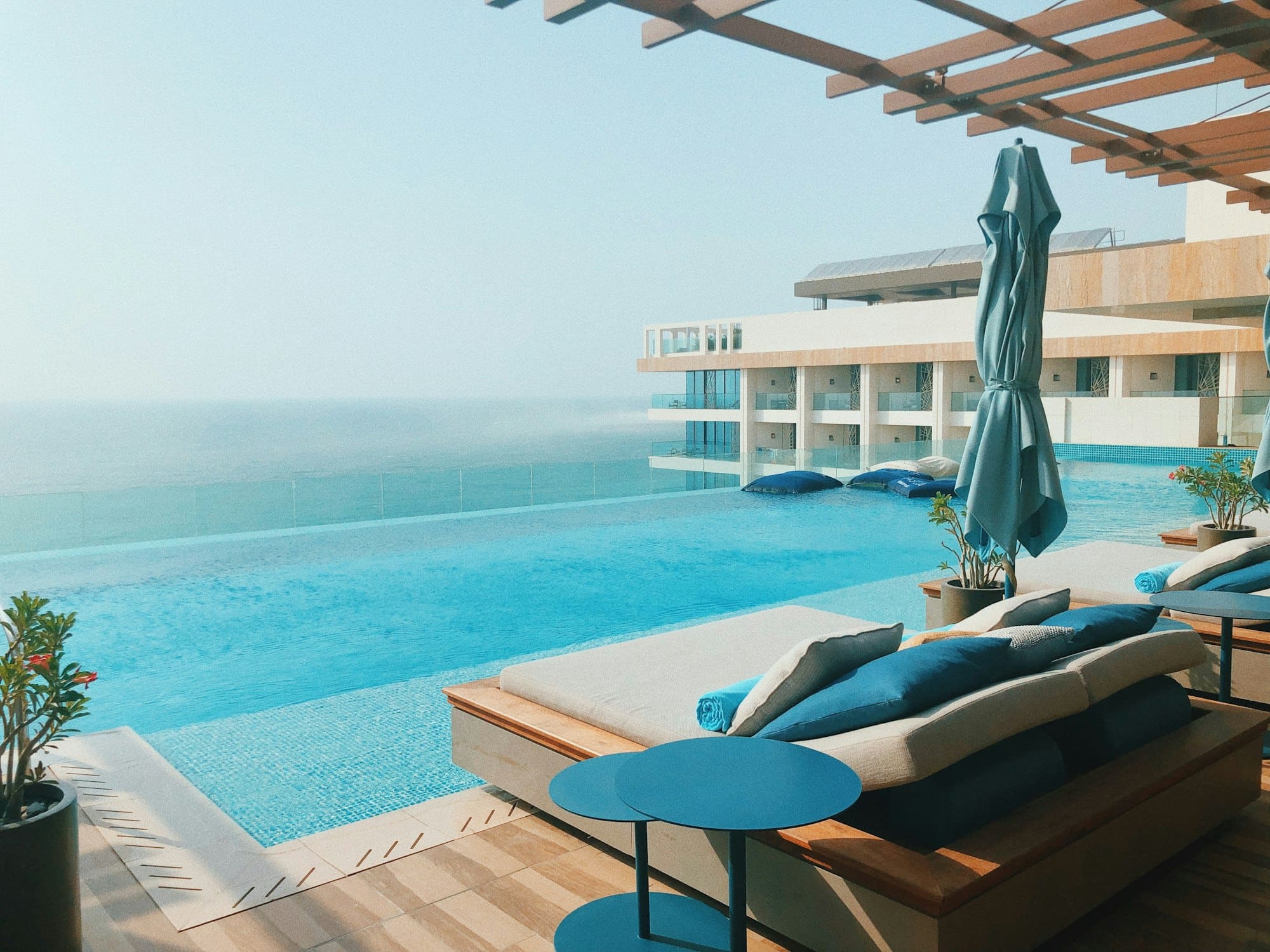 An infinity pool with loungers overlooking the sea