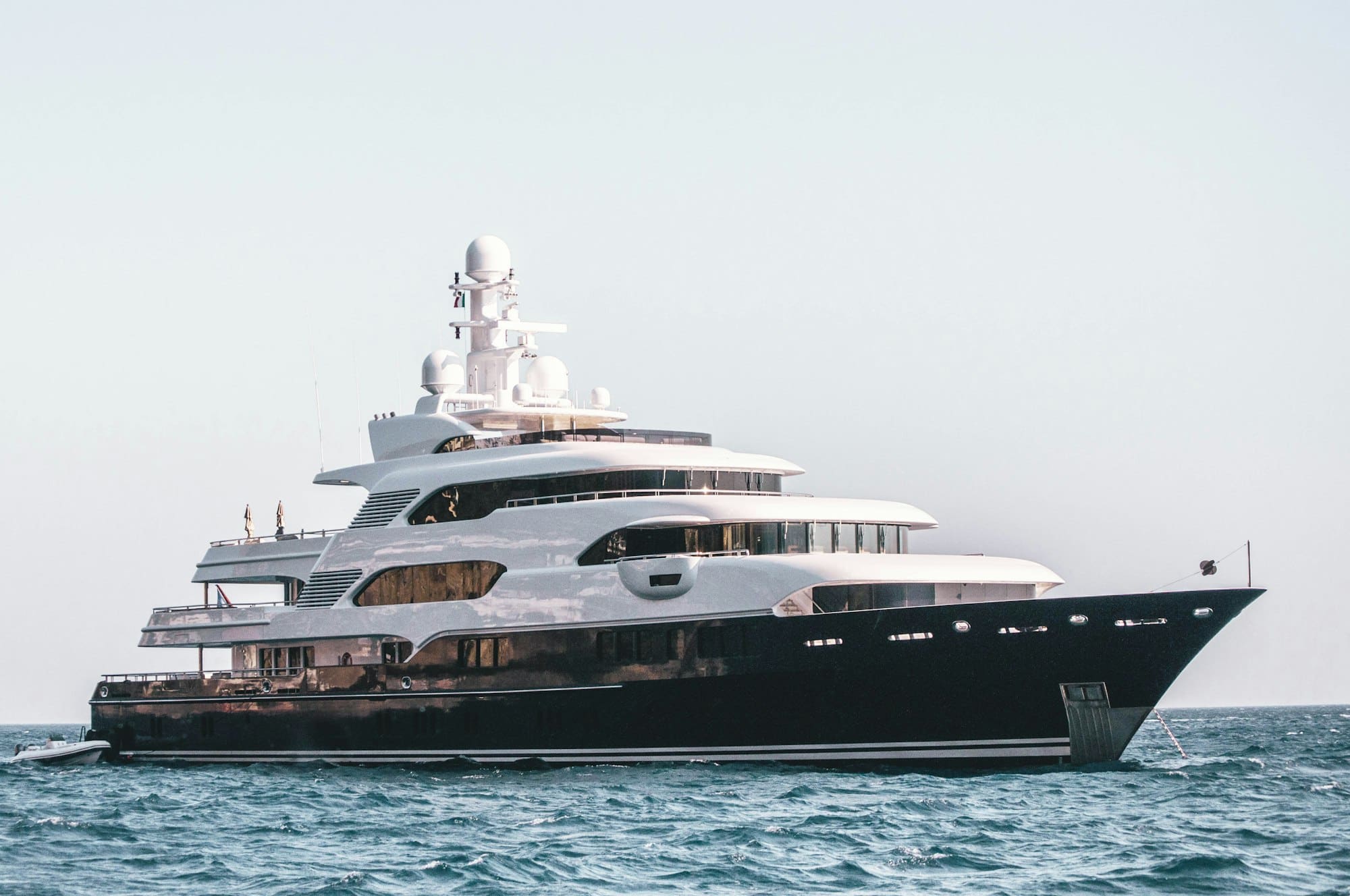 A large motor yacht cruising across calm open water